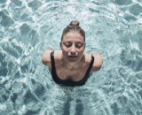 Woman with closed eyes in the pool