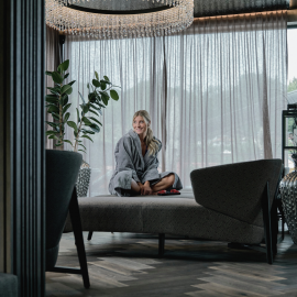 Woman on a lounger in a noble SPA area in the HOCHKÖNIGIN