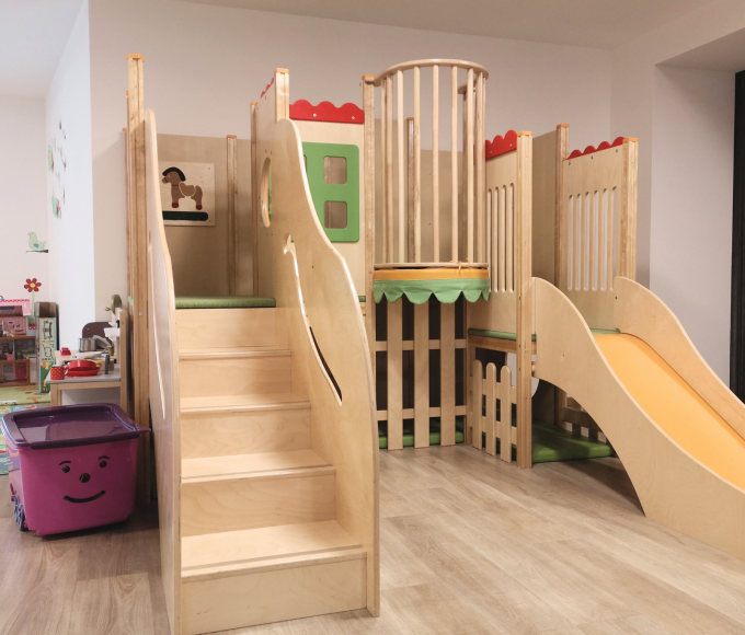 Children's playroom with climbing tower and slide