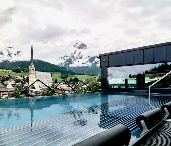 Infinity pool with views of the village of Maria Alm and the Steinernes Meer